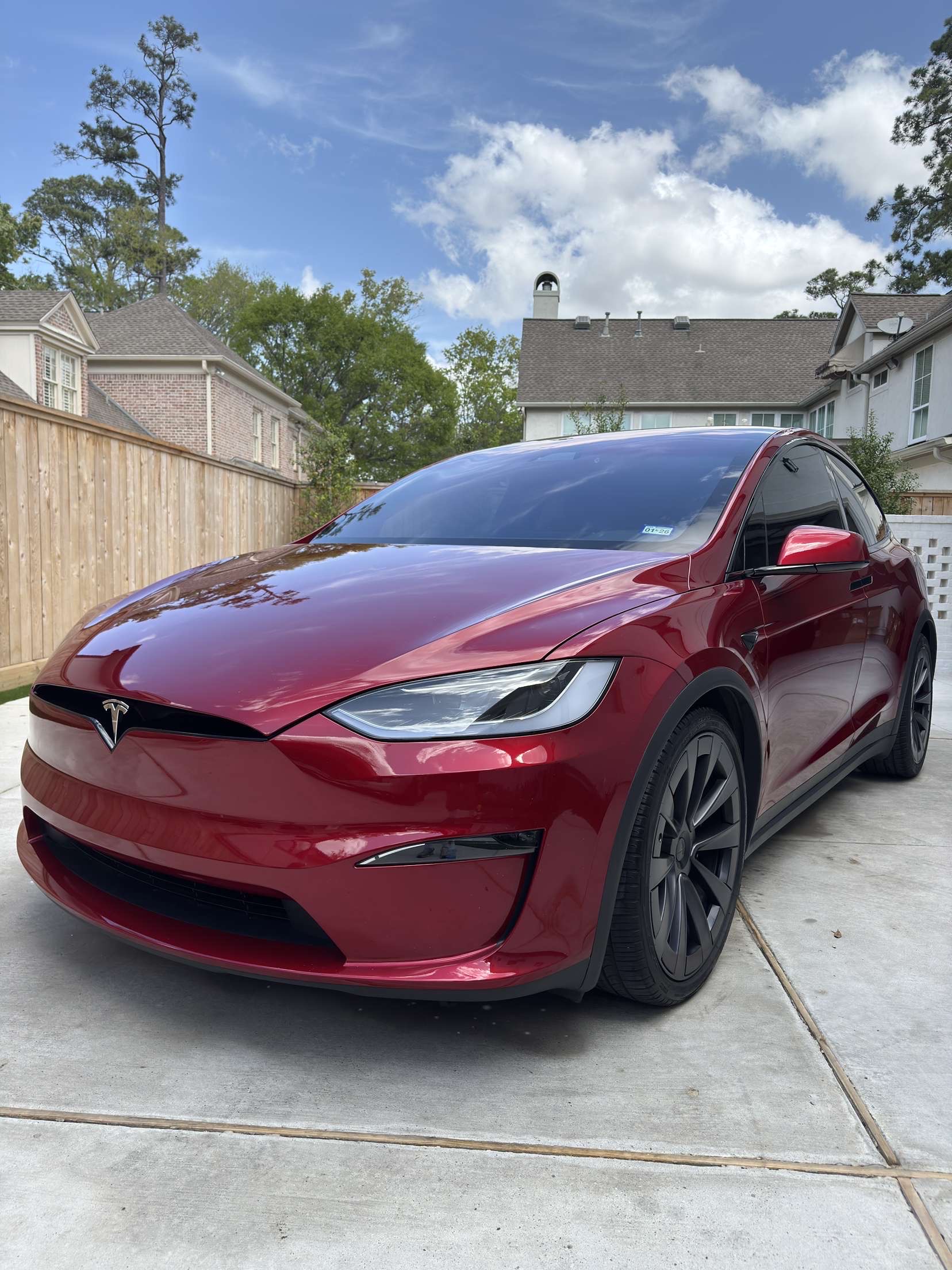 Gleaming red Tesla Model X exterior detail